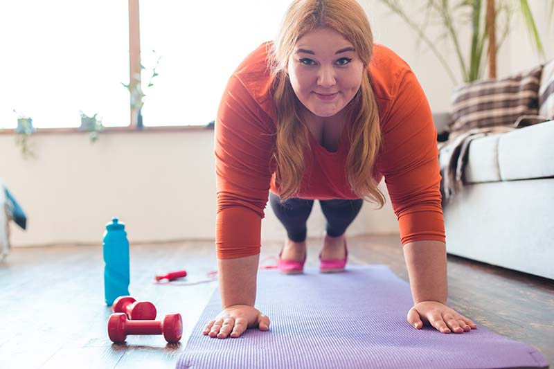 Picture of obese woman doing plank