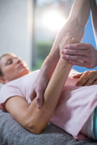 Picture of woman receiving manual therapy on her forearm